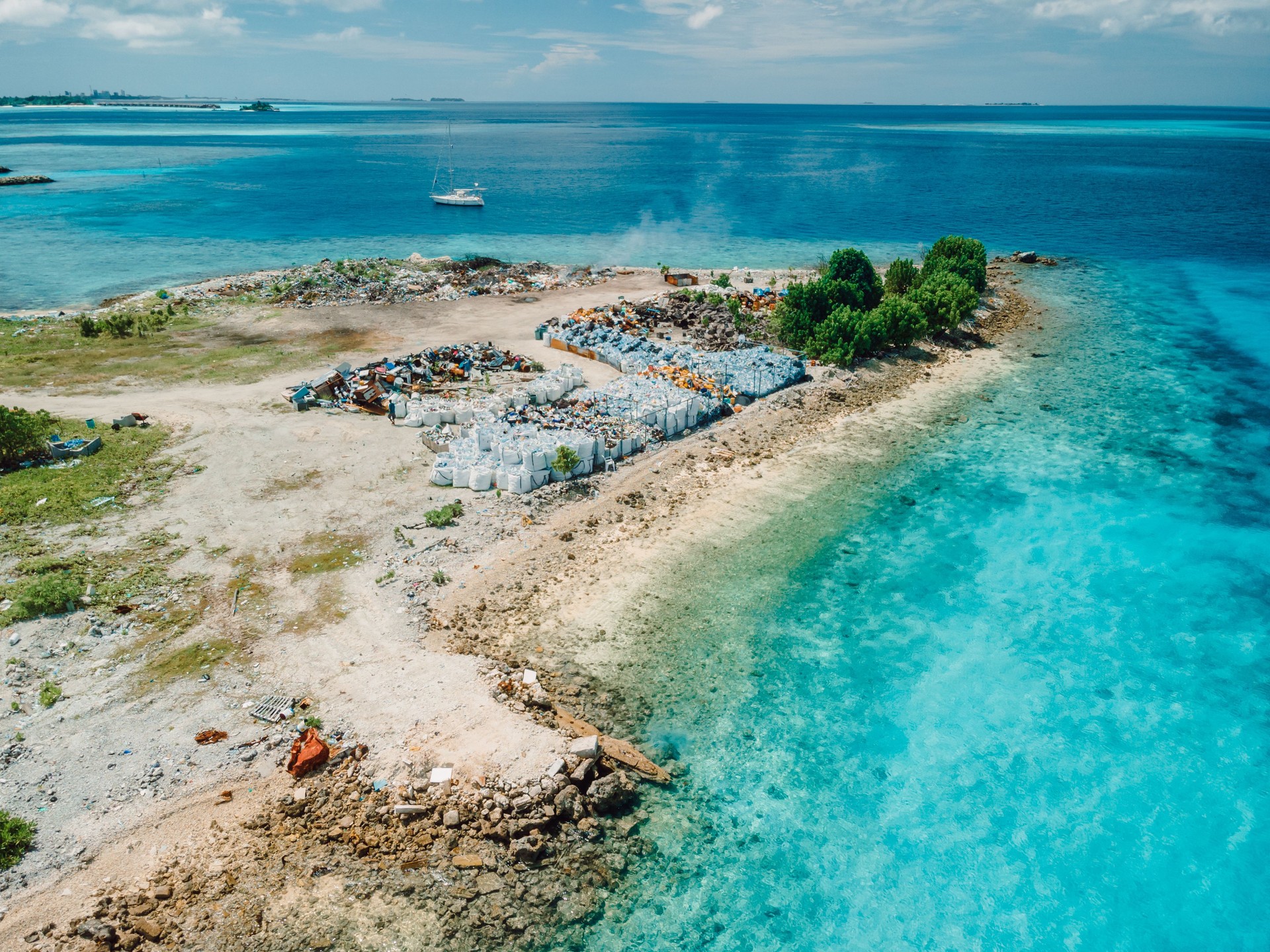 Dump island in Maldives. Aerial view of pollution by toxic rubbish